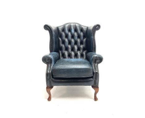 Queen Anne style wing back deep button armchair, upholstered in deep blue leatherDimensions: Length/Width:&nbsp;82cm&nbsp;Cli
