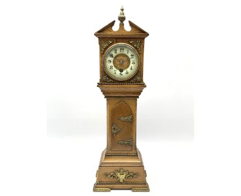 Late 19th century oak miniature longcase timepiece clock, sloped pediment with central finial, circular enamel Arabic chapter