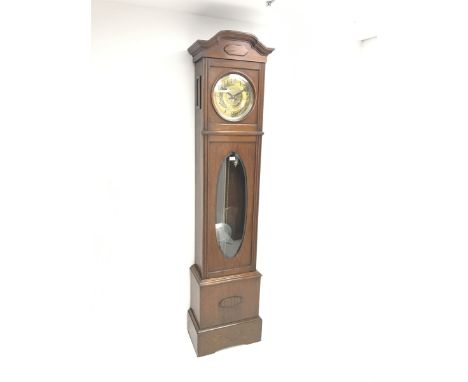 Early 20th century Arts and Crafts oak longcase clock, shaped moulded cornice over circular brass dial with Arabic numerals a