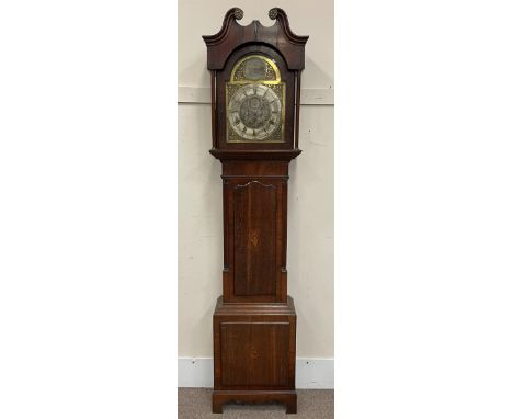 Early 19th century oak and mahogany longcase clock, scrolling pediment over stepped arch glazed door, plain turned pilaster c