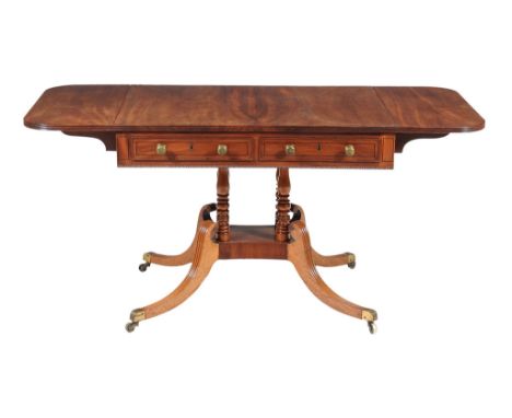  A Regency mahogany sofa table,   circa 1815, in the manner of William Trotter, with a pair of false drawers opposing a pair 