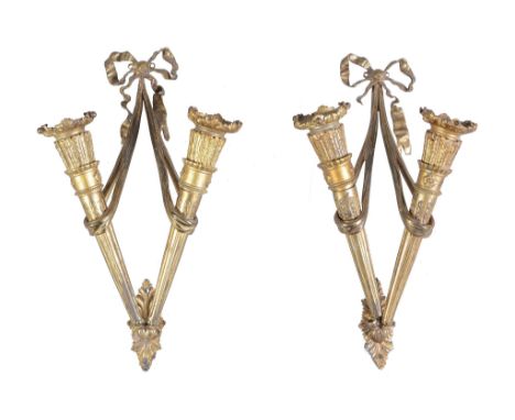  A pair of gilt bronze twin light wall appliques in Louis XVI style,   20th century, each modelled as a pair of swagged and f