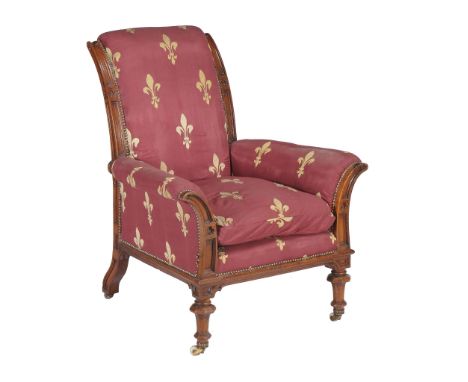  A Victorian walnut armchair,   circa 1880, with padded back, arms and seat, with Gothic trefoil carving, octagonal baluster 