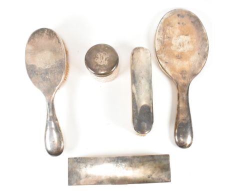 A hallmarked silver dressing table item. The set to include hand mirror and brushes hallmarked London 1904 G&amp;SCo Ltd. A t