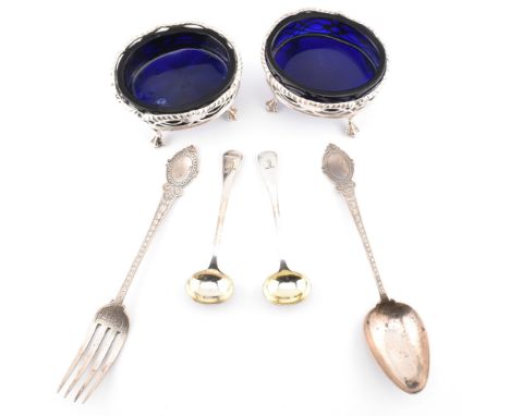 A pair of hallmarked George III silver salt cellars together with a pair of Victorian salt spoons and a Victorian spoon and f