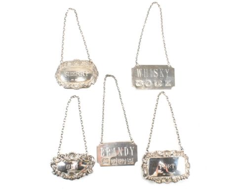 A collection of silver decanter labels. The labels to include Port, Whiskey Sherry, Brandy and Gin. All hallmarked for Birmin