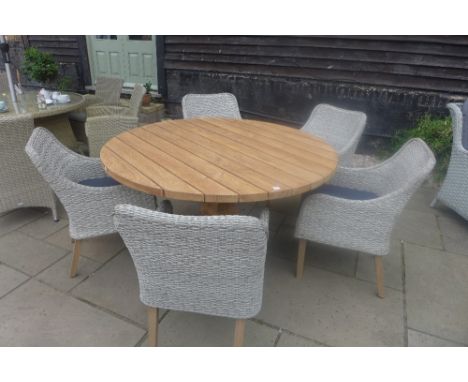 A Bramblecrest Kuta 145cm vintage teak table with five Canberra dining armchairs, ex-display