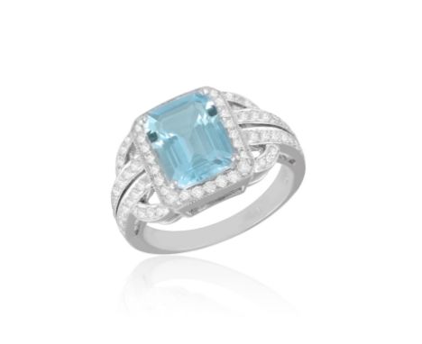AN AQUAMARINE AND DIAMOND DRESS RINGThe rectangular-cut aquamarine within a four-claw setting, within a brilliant-cut diamond
