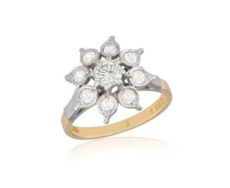A DIAMOND RINGDesigned as a flower, set with brilliant-cut diamonds in a raised gallery, mounted in 18K gold, numbered, diamo