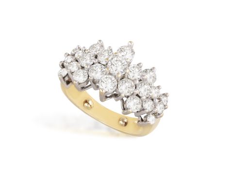 A DIAMOND DRESS RINGOf cluster-design, the raised mount claw-set with brilliant-cut diamonds, mounted in 14K gold, diamonds a