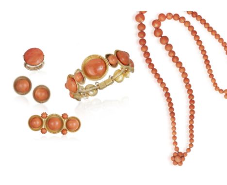 A CORAL DEMI PARURE AND A NECKLACEComprising: a hinged bangle, a brooch, a pair of ear clips and a ring, designed as circular