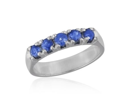 A SAPPHIRE FIVE-STONE RINGThe frontispiece set with five circular-cut sapphires, to a plain hoop, mounted in 18K gold, Italia