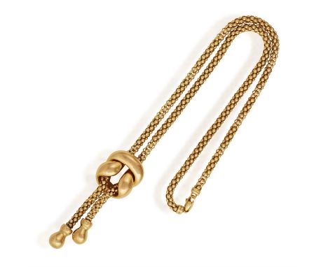 A PENDANT NECKLACE Designed as a fancy-link chain, set to the front with a detachable polished knot motif, suspending two dro
