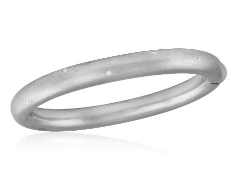 AN 18K WHITE GOLD AND DIAMOND BANGLE BRACELETThe hinged bangle of matt-finish design, enhance by brilliant-cut diamonds, in 1