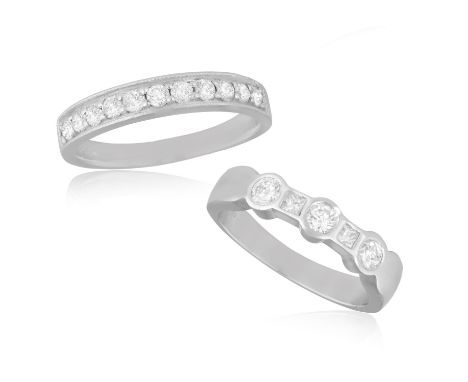 TWO DIAMOND RINGSThe first one set with three brilliant and square-cut diamonds to the front, mounted in platinum, diamonds a