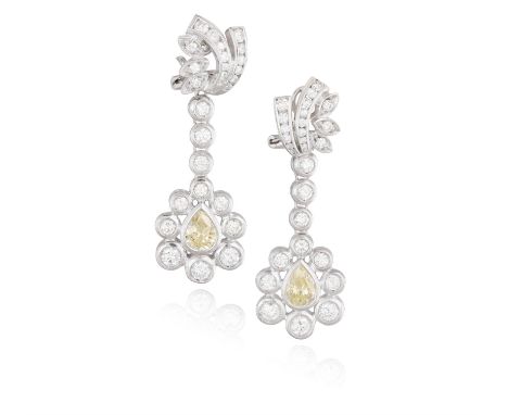 A PAIR DIAMOND PENDENT EARRINGSEach pendent of cluster design, set with a pear-shaped diamond of yellow tint weighing approxi