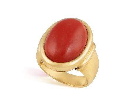 A CORAL RINGThe coral cabochon set within a collet, to tapered shoulder and polished mount, in 18K gold, ring size M½ (sizing