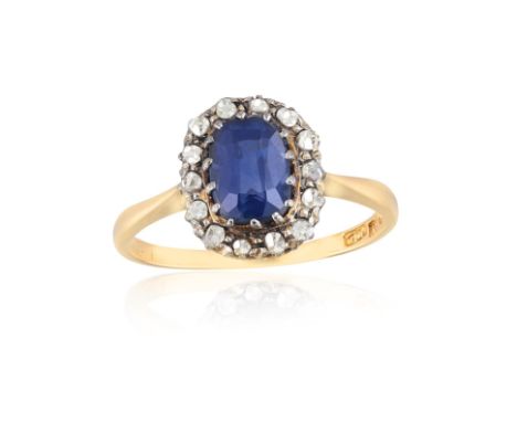 A SAPPHIRE AND DIAMOND RINGClaw-set with a cushion-shaped sapphire weighing approximately 1.10cts, framed by rose-cut diamond