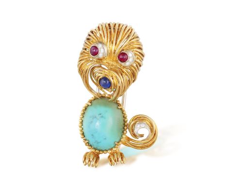 A GEM-SET NOVELTY BROOCH, ITALIAN, CIRCA 1960The whimsical textured gold dog, decorated with an oval-shaped turquoise cabocho