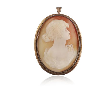 A SHELL CAMEO BROOCH, 1933The shell cameo depicting a lady in profile, within a collet-set mount with ropetwist detailing, ma