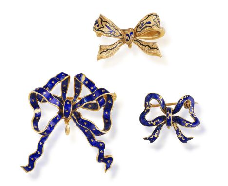 A GROUP OF THREE ENAMEL BROOCHESEach designed as a stylised bow, decorated with blue enamel, mounted in 18K gold, lengths 3.8