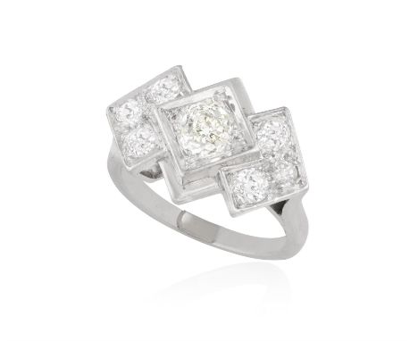 AN ART DECO DIAMOND RINGDesigned as three lozenge-shaped motifs, set with a central cushion-shaped diamond weighing approxima
