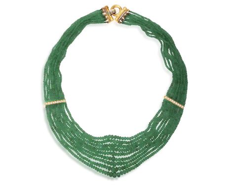 AN EMERALD BEAD AND DIAMOND NECKLACEOf swag design, composed of nine strands of graduated faceted emerald beads, with two bri