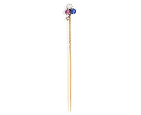 A LATE 19TH CENTURY SAPPHIRE, RUBY AND DIAMOND HAT PINDesigned as a shamrock clover, the cluster set with a circular-cut sapp