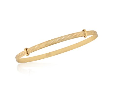 A GOLD BABY BANGLE BRACELETThe adjustable bangle with engraved detailing, in 9K gold, English hallmarks, adjustable length* T