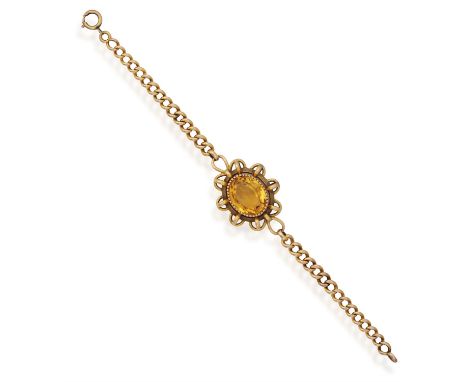 A CITRINE BRACELETThe oval-shaped citrine weighing approximately 12cts, set within a reeded collet and outer frame of interlo