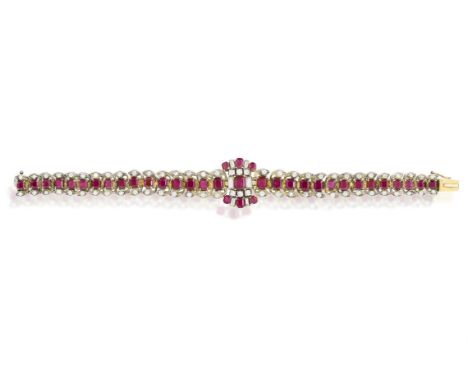 A RUBY AND DIAMOND BRACELET, CIRA 1950Of articulated design, the central fancy-shaped motif set with rectangular-cut and squa