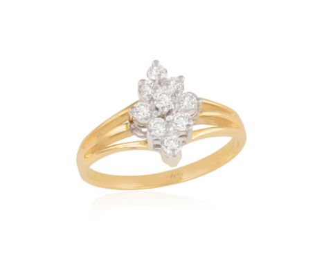 A DIAMOND DRESS RINGOf bi-coloured design, the marquise-shaped cluster set with brilliant-cut diamonds, to tri-furcated shoul