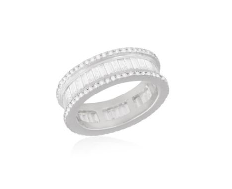 A DIAMOND ETERNITY RING Central line set with baguette-cut diamonds, flanked by brilliant-cut diamonds, mounted in 18K gold, 