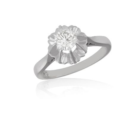 A DIAMOND SINGLE-STONE RING, CIRCA 1960The raised European-cut diamond, within claw-setting, mounted in 18K gold, indistinct 