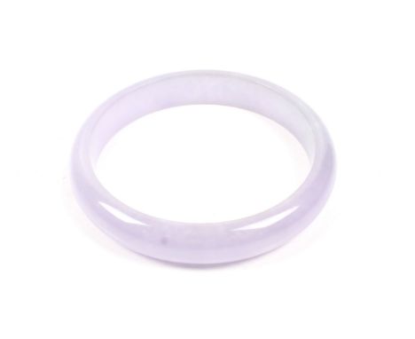 A jadeite slave bangle probably stained purple. Diameter 8cm, in a 'Dynasty Jewellery' fitted box