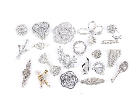 Twenty various brooches, mostly set with white crystal or paste. Including a male tennis player resembling John McEnroe playi
