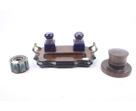 A 19th century desk stand, turned wooden inkwell and a gouda inkwell. The wooden desk stand with brass handles and bun feet, 