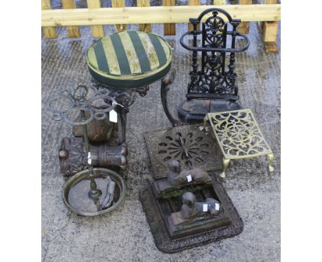 A mixed group of vintage metalware. Including a boot scrap with sphinx, a brass trivet and a pub stool, etc. Max. H54cm