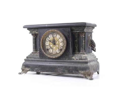 A Victorian black marble effect wooden cased mantel clock. With an 8 day movement, pierced gilt metal dial with printed Arabi