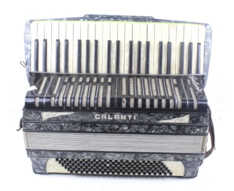 A vintage Galanti piano accordion. Faux mother of pearl body, marked 'Made in Italy' comes with leather straps. H40cm