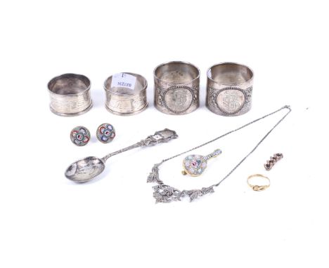 A collection of jewellery and various silver napkin rings. The jewellery includes a 19th century gold knot ring, unmarked, si