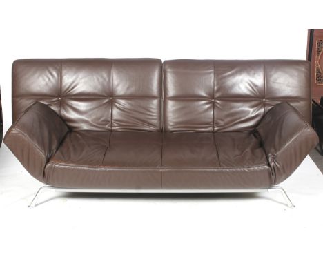 A Ligne Roset Smala three seater brown leather sofa bed. Raised on metal support. With manual drop/raise back and arms.  Bed 