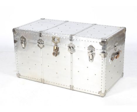 A large German mid-century aluminium travel steamer trunk. Leather handles at each end, a later light blue lining and two fun