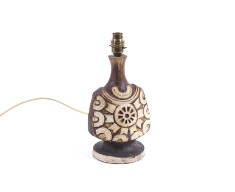 A mid-century Tremaen Cornish Studio Art Pottery table lamp. Of bottle form on a circular base, with relief wheel decoration.