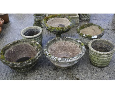 A group of six assorted reconstituted stone garden planters. Including two pairs of circular planters, a planter on stand and