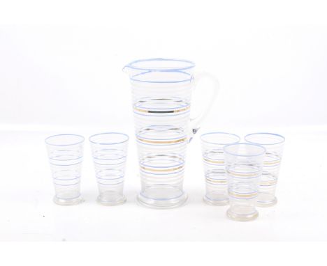 A vintage lemonade set. Comprising a jug and five glasses, all of tapered form and decorated with blue, white and gold horizo