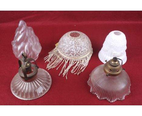 Five vintage glass lamp shades. Comprising a domed marbled example with tassels, two with ribbed details, one embossed with f