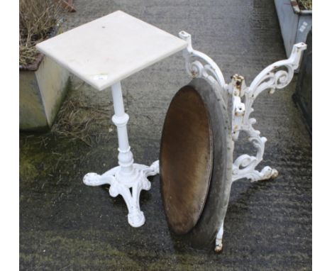 Two antique garden tables. With scrolling cast metal frames on a tripod base, one with a square top, H72cm x W36cm, the other