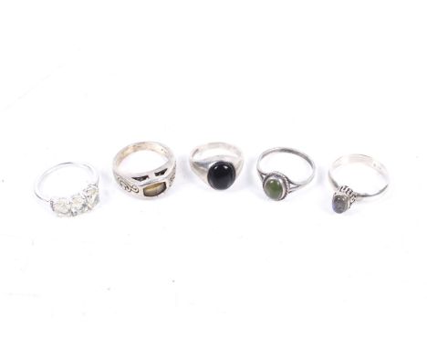 Five gem set rings each stamped '925'. Including an oval green stone imitating nephrite, size O/P; and an oval black-onyx sin