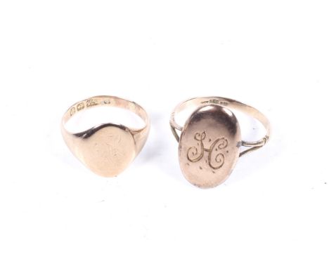 An early 20th century 9ct oval signet ring and a yellow metal signet ring. The yellow metal signet ring with split shoulders,